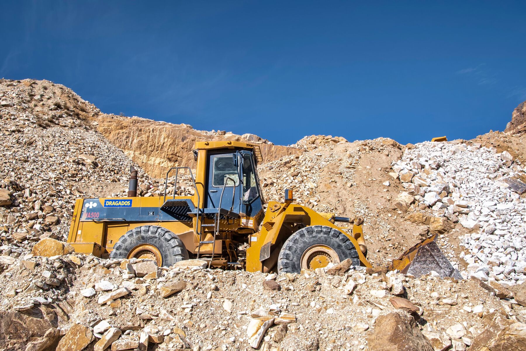Wheel loader working a stockpile on a quarry site
